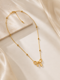 Gold necklace with a bow pendant for everyday minimalistic look