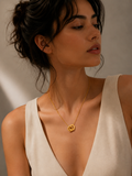 Woman wearing a gold necklace that is waterproof and anti tarnish