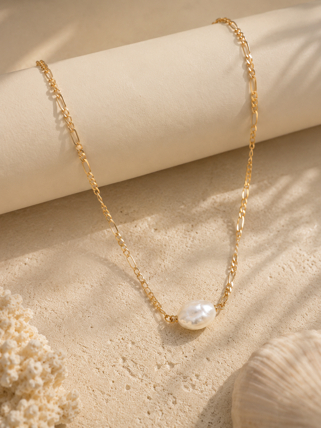 Gold necklace with a pearl pendant for beach wear 